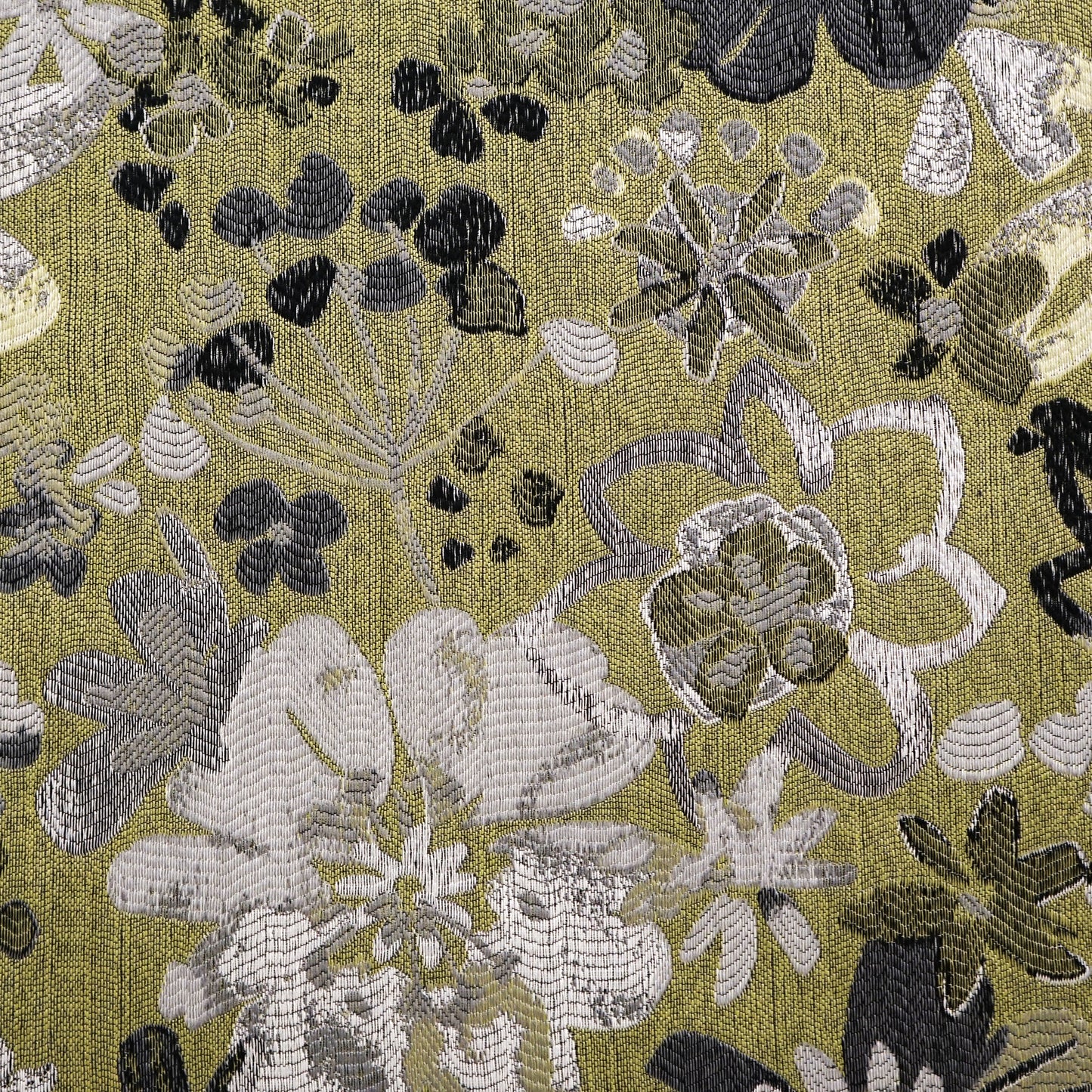 Green jacquard fabric with a floral pattern; ornate tapestry-style, suitable for upholstery or drapes.