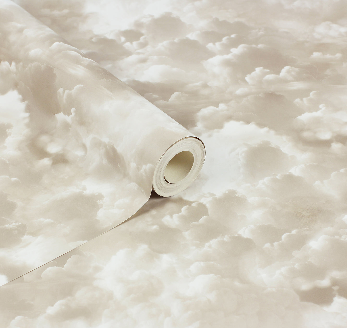 Beige cloud-pattern wallpaper roll, cream and tan hues, partially unrolled.