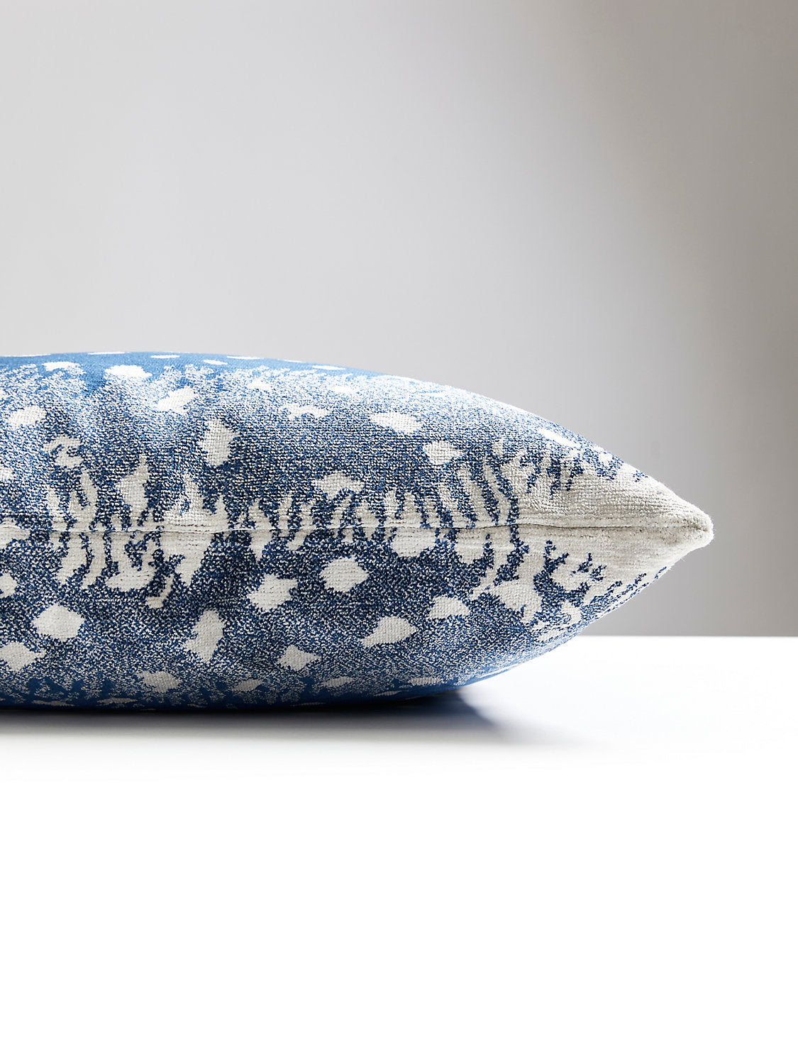 22-inch Scalamandré Antelope Midnight designer throw pillow with ombré animal print pattern in rich midnight blue tones. Luxury decorative accent pillow handcrafted in the USA with textured fabric and feather down insert for upscale living rooms, modern glam interiors, designer sofas, and luxury home decor.