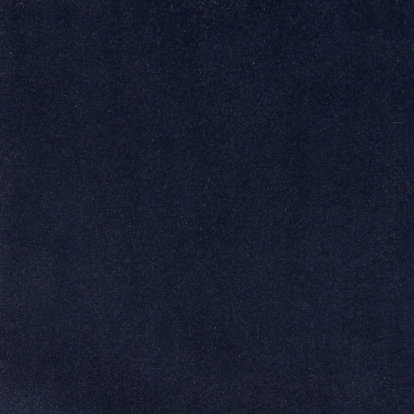 Dark navy velvet fabric swatch with soft nap and subtle sheen, ideal for upholstery or apparel.