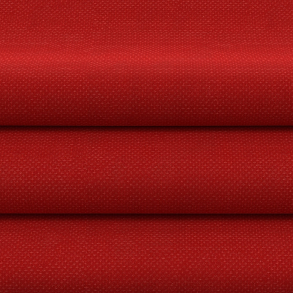 Red solid fabric, folded into stacked horizontal layers.