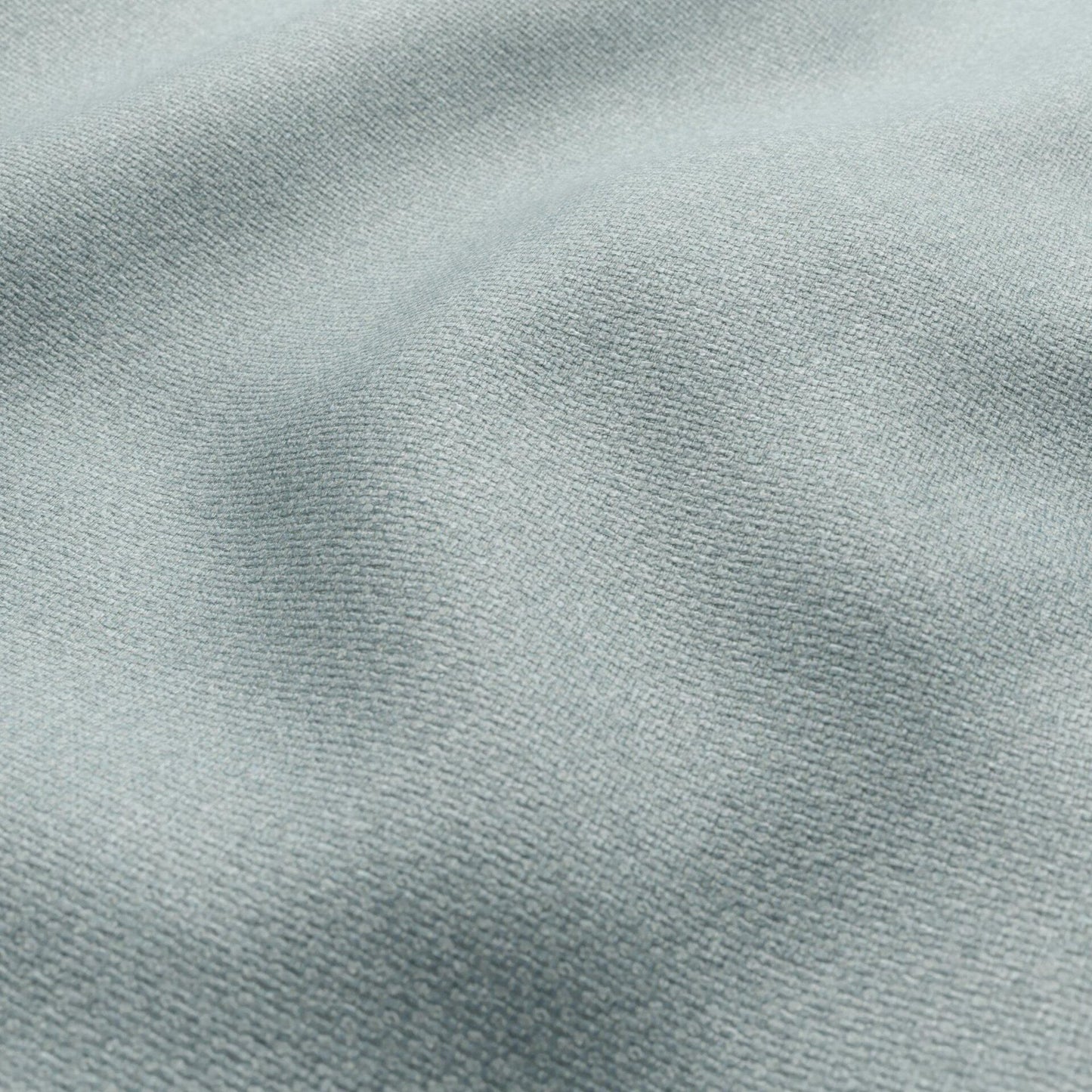 Close-up of blue basketweave fabric with a soft drape and textured weave.