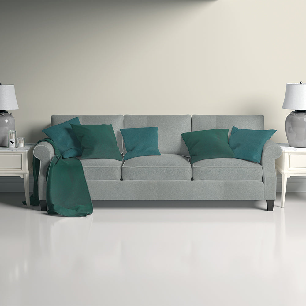 Petrol solid upholstery fabric shown in a lifestyle image; plain blue-green fabric.
