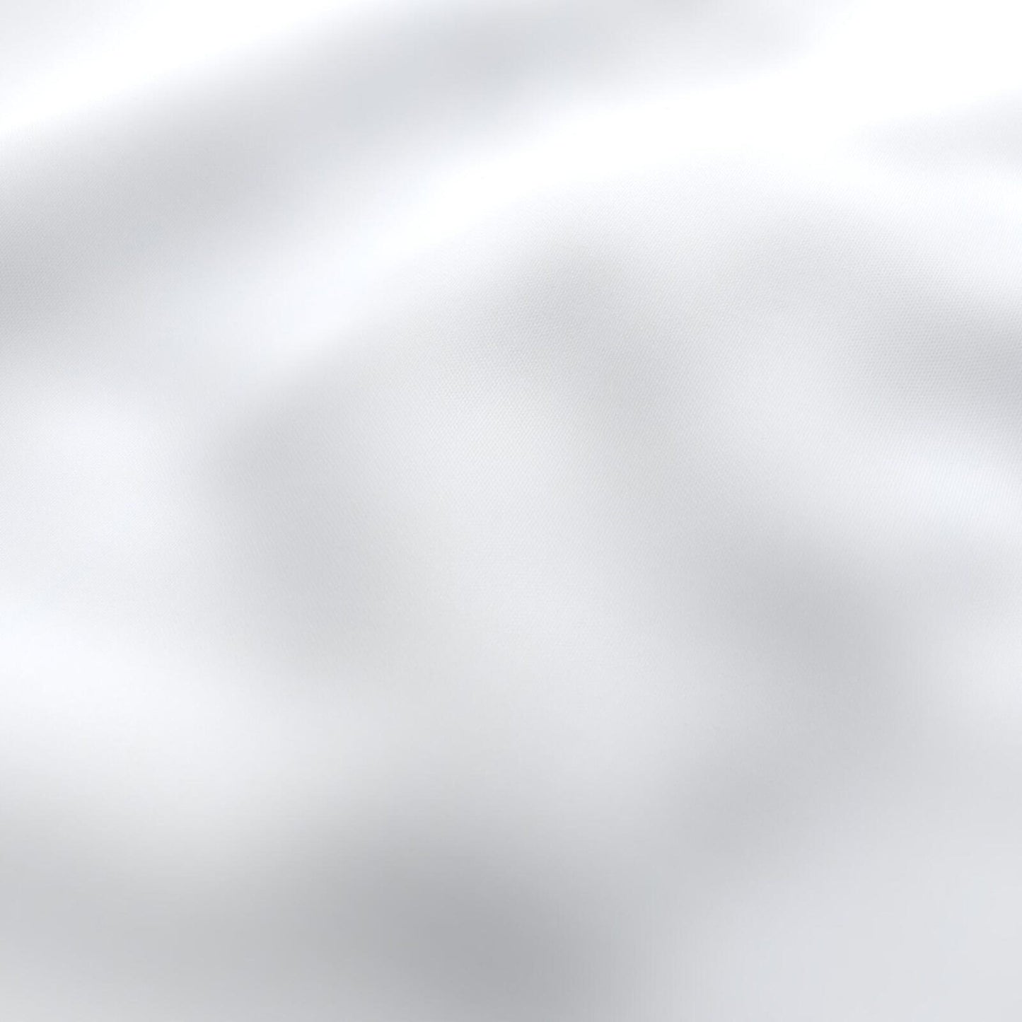 Soft white outdoor fabric close-up with gentle folds and shadows; textured textile.