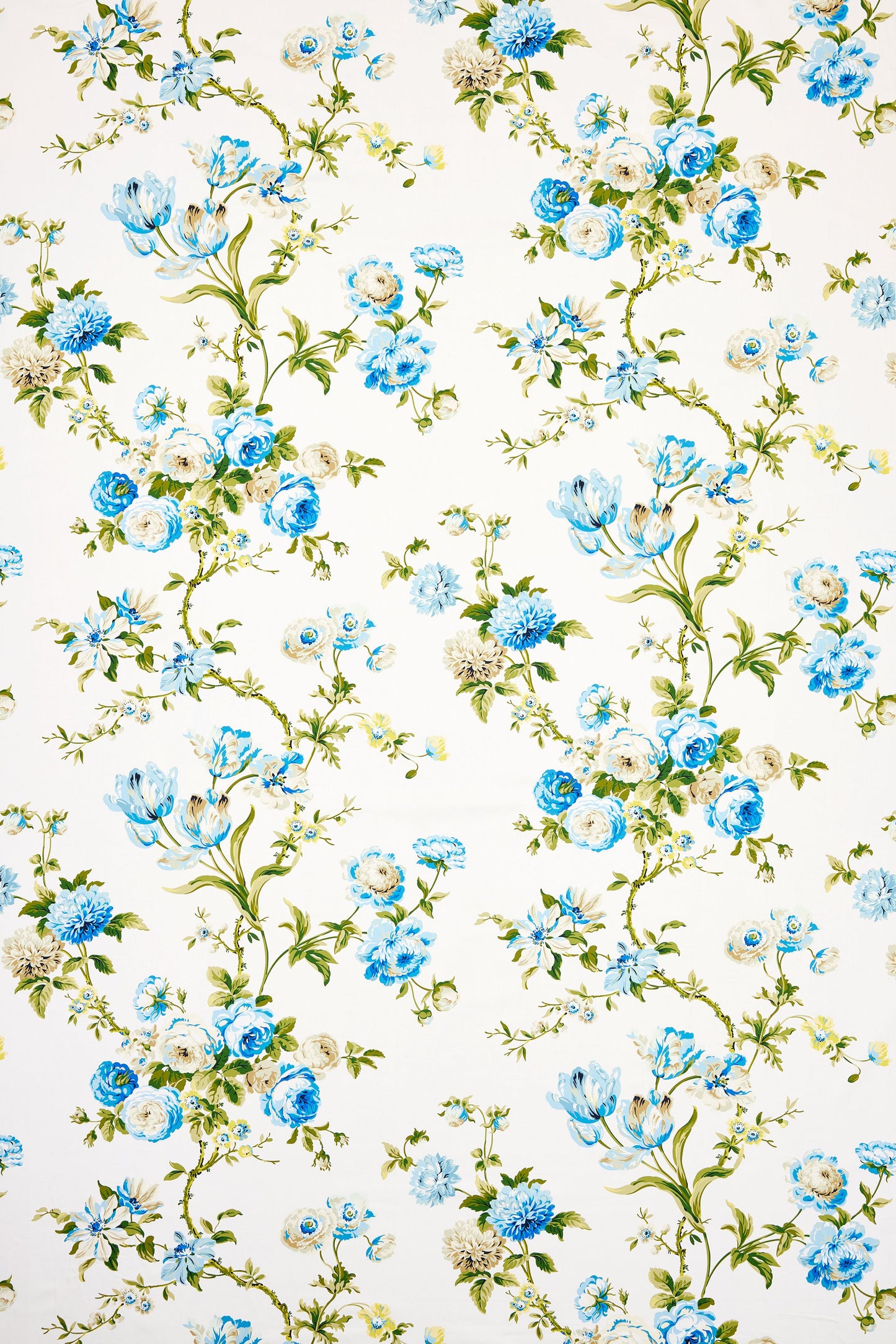 White fabric with blue flowers and green vines in a delicate botanical pattern