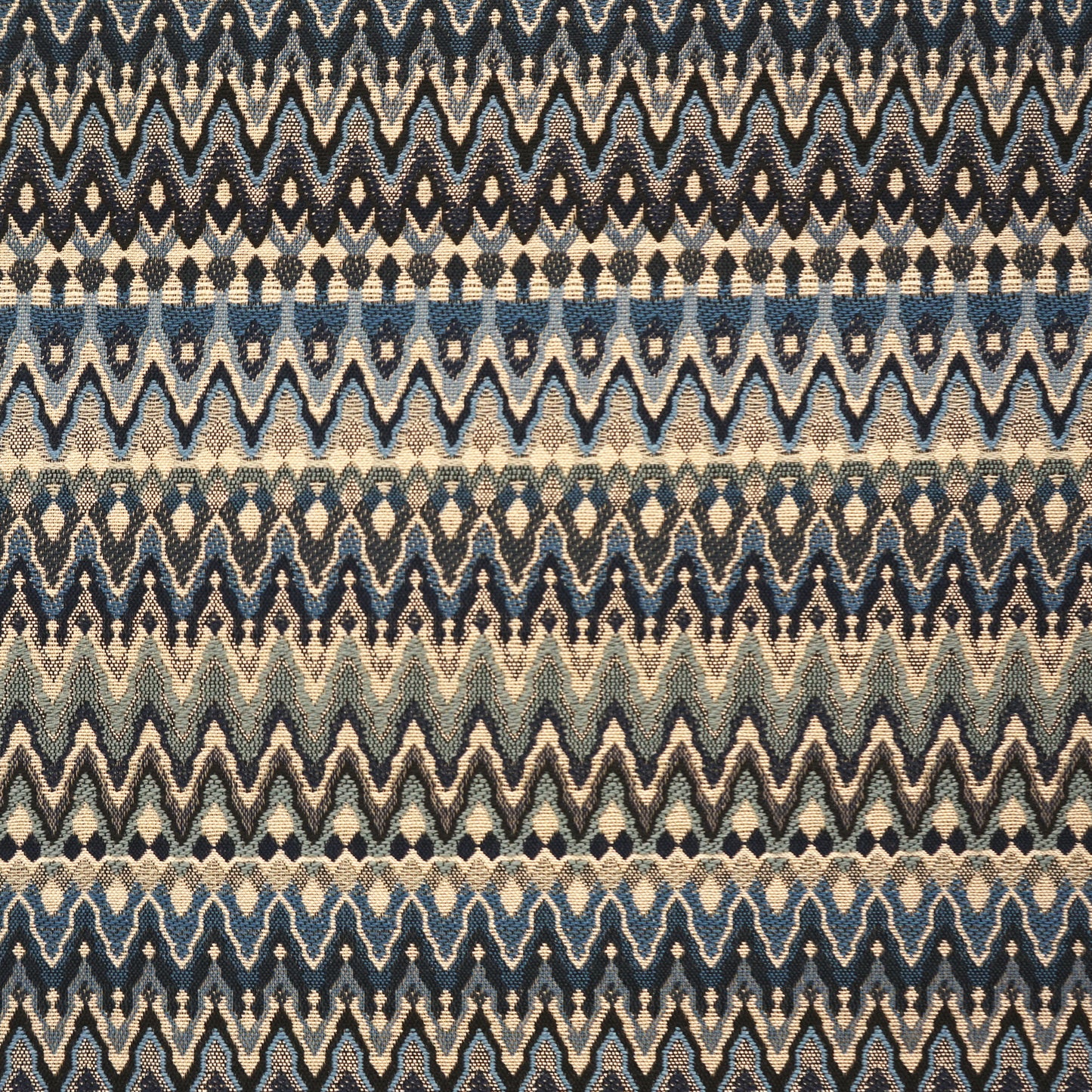 Blue and beige chevron zigzag woven fabric with horizontal stripe bands.
