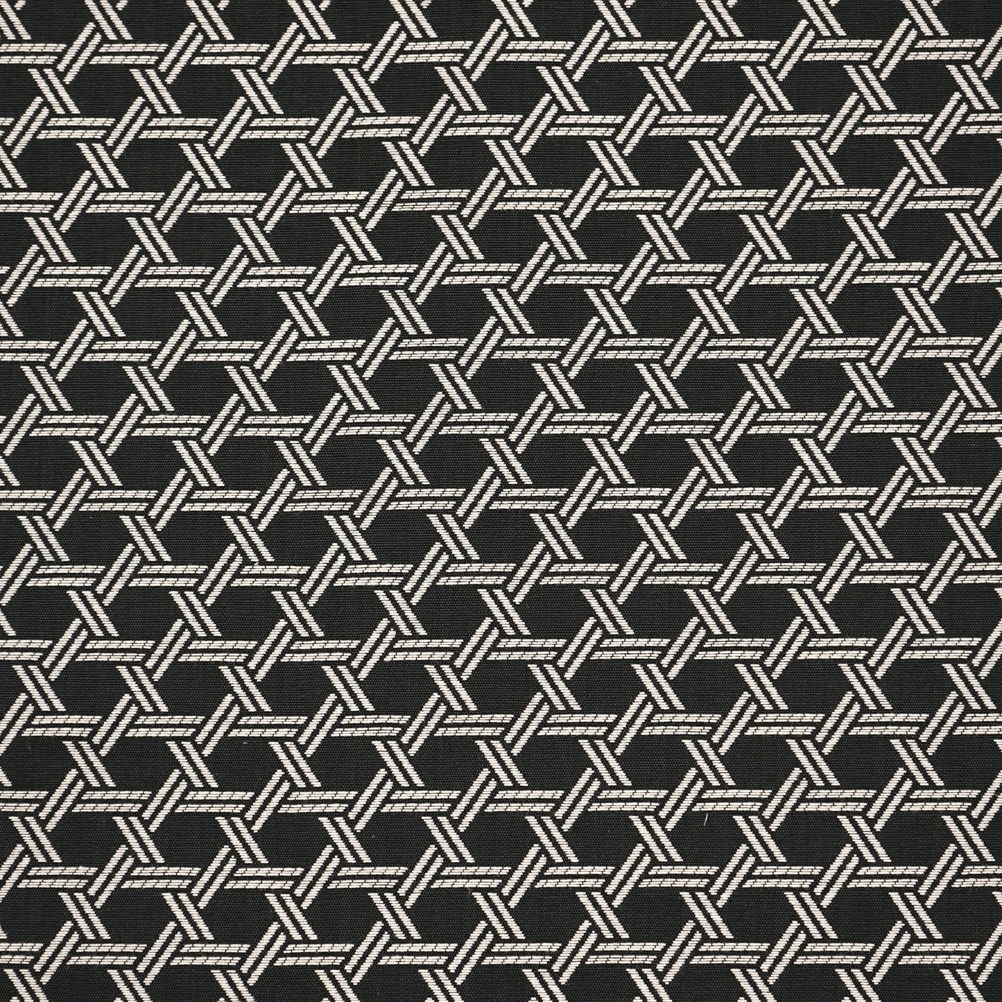 Dark fabric with an off-white interlocking diagonal weave forming hexagon-like tile motifs