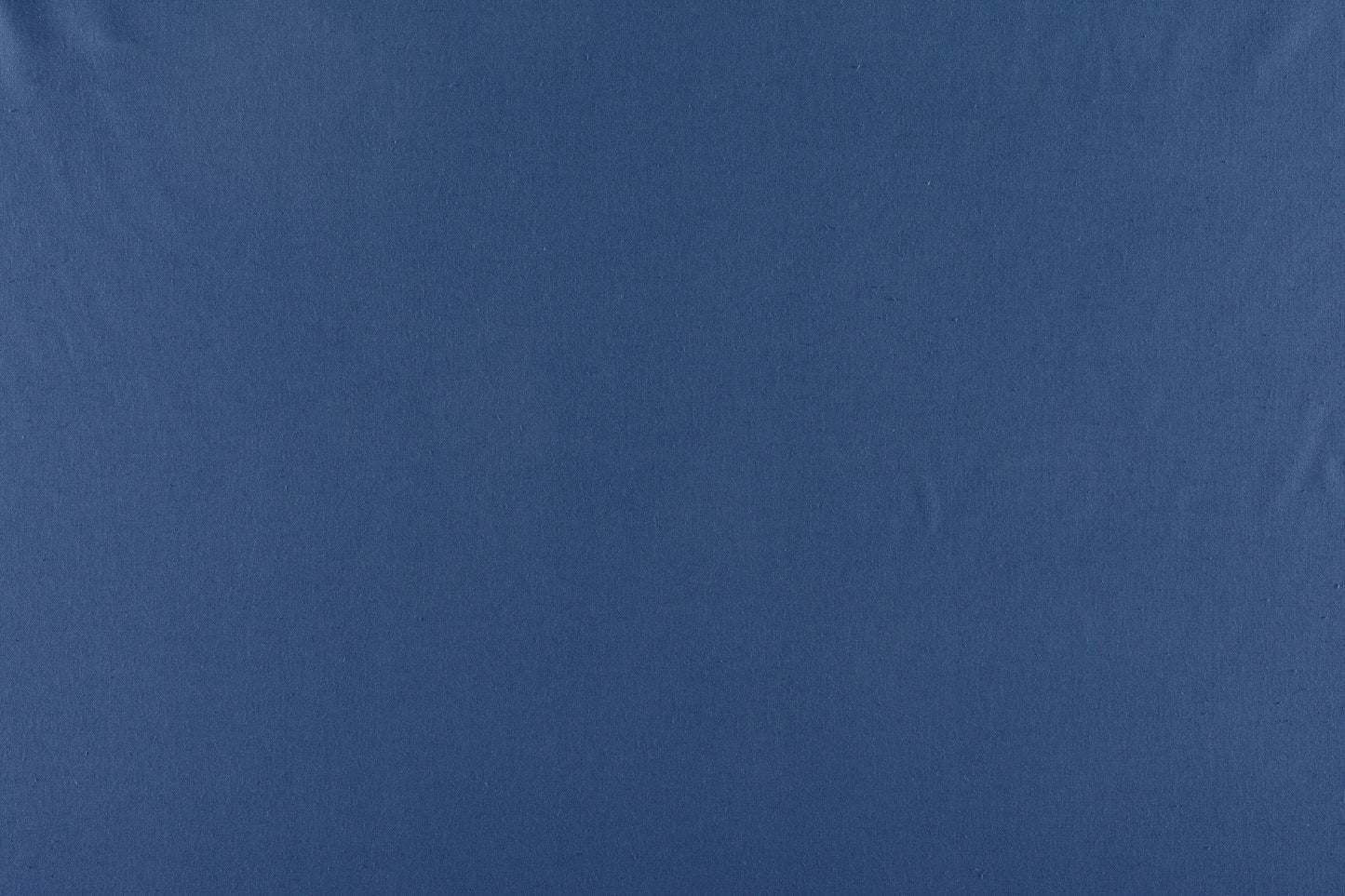 Solid navy canvas fabric swatch with subtle texture and gentle folds.