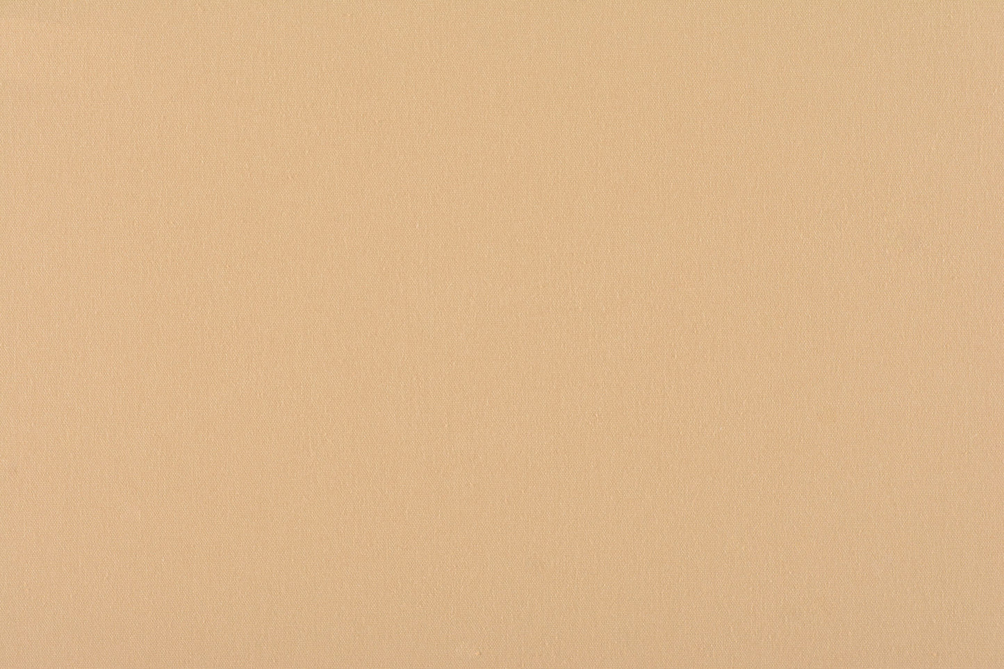 Peach-beige canvas fabric swatch with smooth matte finish; versatile neutral for clothing or home decor.