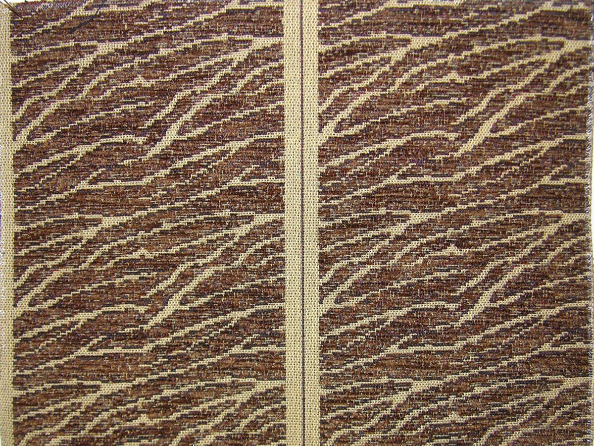 Brown and beige zebra-striped two-panel fabric with cream divider, textured woven, rustic living room decor.