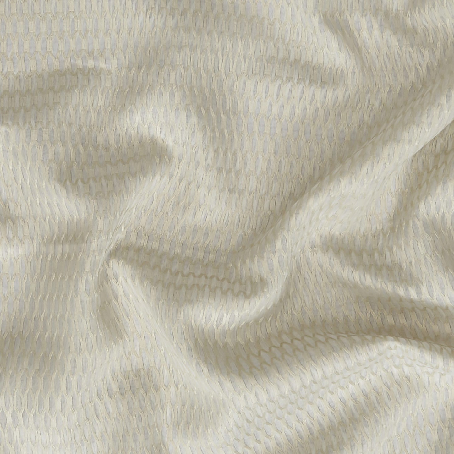 Geometric green sheer fabric with a fine weave; wide width.