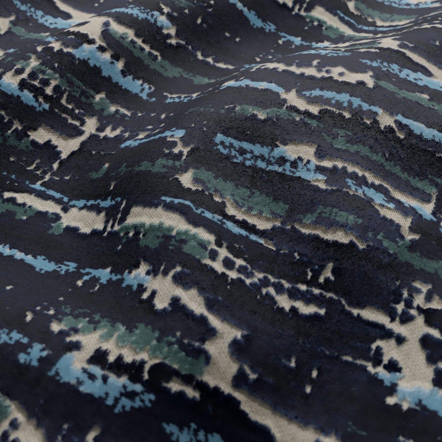 Navy velvet fabric with teal, sky blue and beige brushstroke pattern; plush, abstract camo-inspired textile for upholstery or apparel.