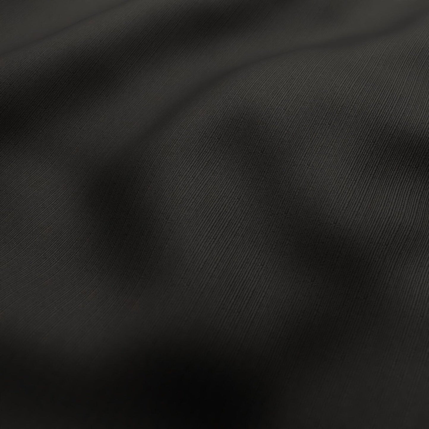 Close-up of charcoal black fabric with fine diagonal twill texture and soft drape.