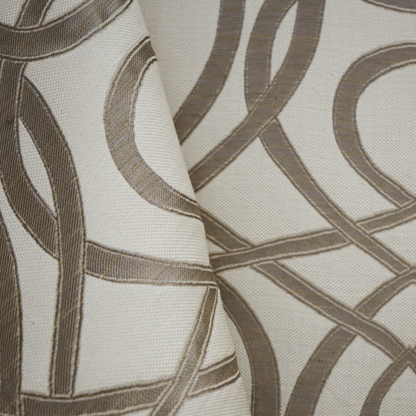 Beige linen-style fabric with taupe looping abstract chain pattern; soft drape for curtains.