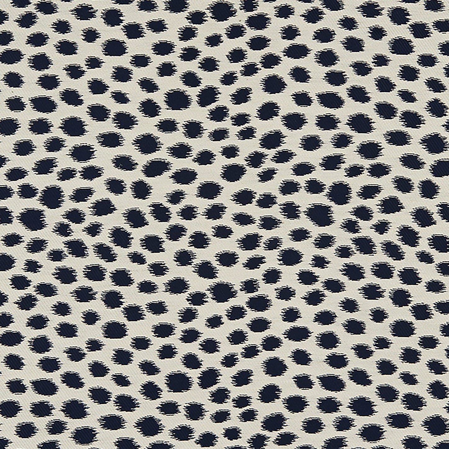 Beige woven fabric with navy Dalmatian spots.