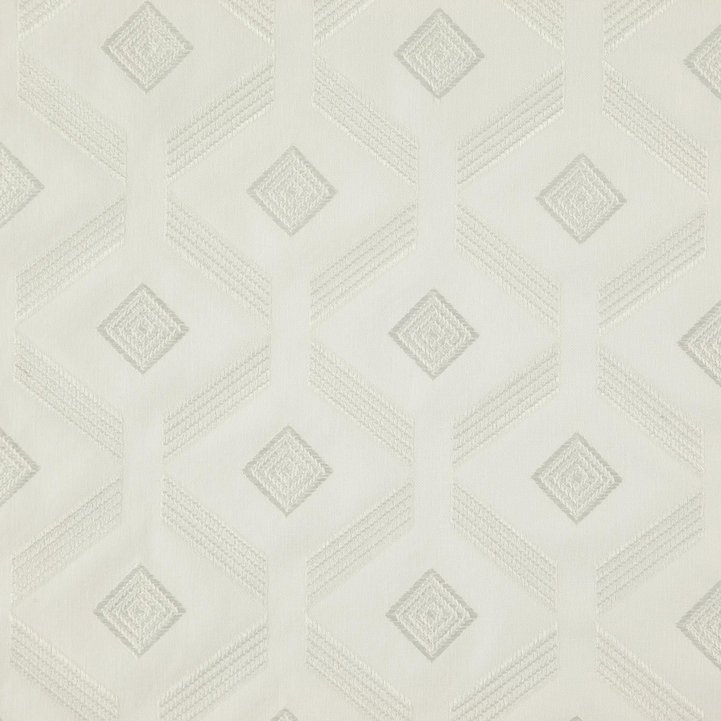 Off-white fabric with white embroidery forming a diamond geometric pattern and a subtle textured surface.