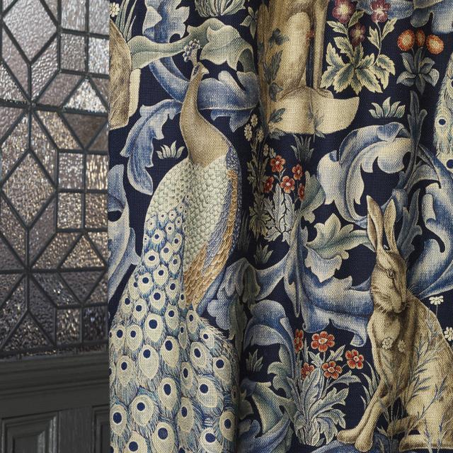 Morris & Co Forest Indigo fabric 85% viscose 15% linen with tapestry-inspired botanical, bird, and animal motifs — perfect for upholstery, curtains, and decorative home projects.
