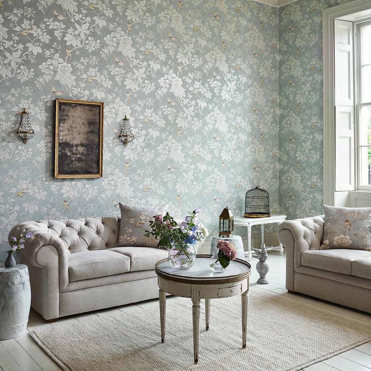 Sanderson Chiswick Grove Silver Wallpaper showcasing delicate branches and birds in soft, muted tones, ideal for creating a serene and elegant atmosphere in any room.