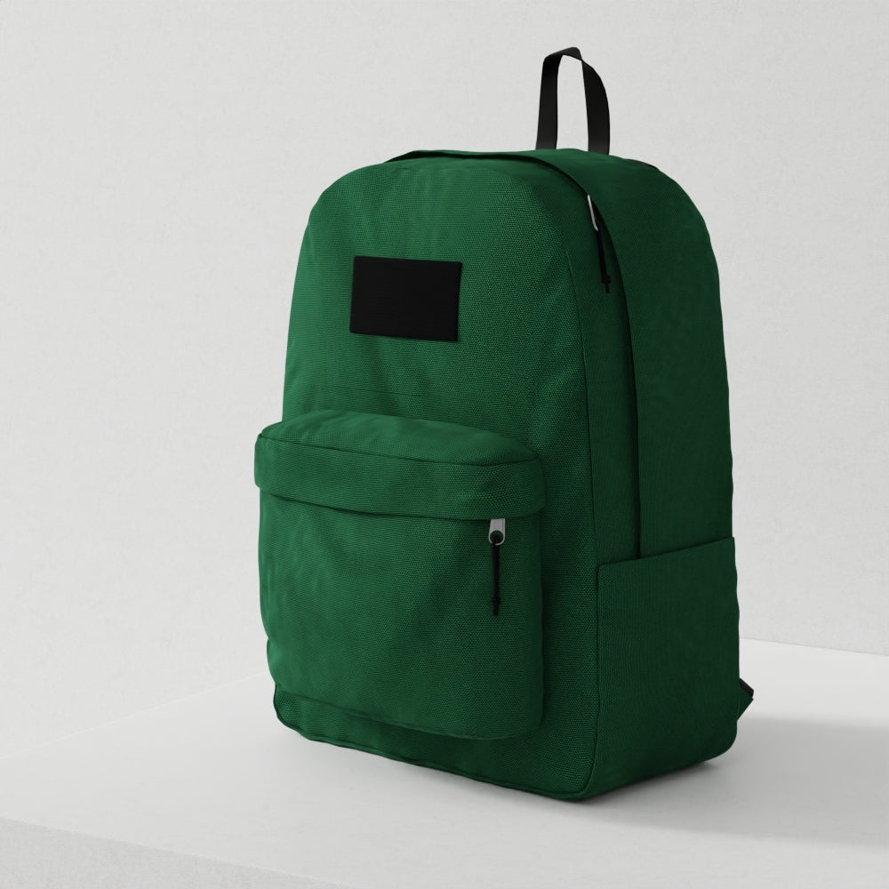 Green backpack with top handle, front zip pocket, and black patch label; versatile everyday bag.