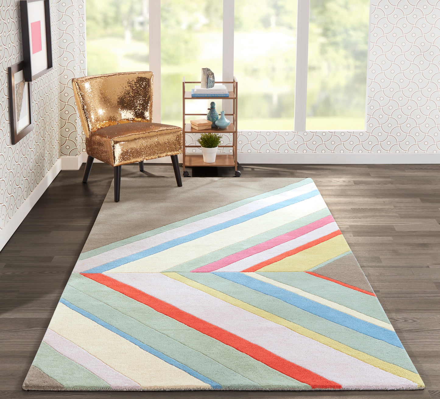 Colorful diagonal striped area rug in pastel blues, greens, pinks and yellows; gold sequin accent chair nearby.
