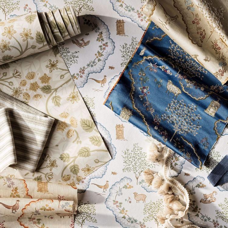 Wallpaper swatches with floral and damask patterns in cream, sage, and blue with gold detailing, decorative wall covering.