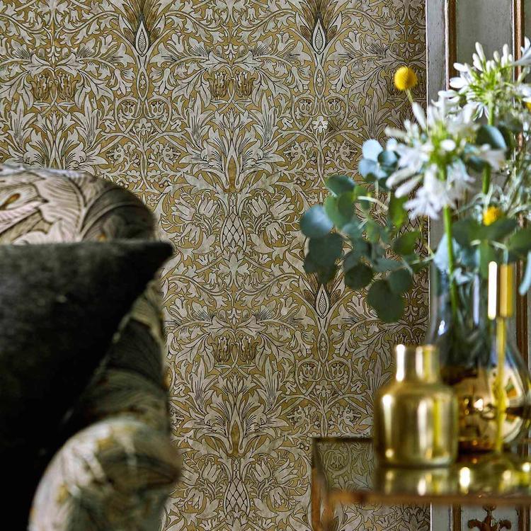William Morris Snakeshead wallpaper in gold linen colorway featuring intricate floral fritillary pattern, vintage botanical wallpaper design, luxury English wallpaper, classic Arts and Crafts style wallcovering, elegant neutral wallpaper for living room, bedroom accent wall, traditional interior design, high-end designer wallpaper, warm earthy tones, heritage floral pattern, Morris & Co Archive IV Collector collection wallpaper
