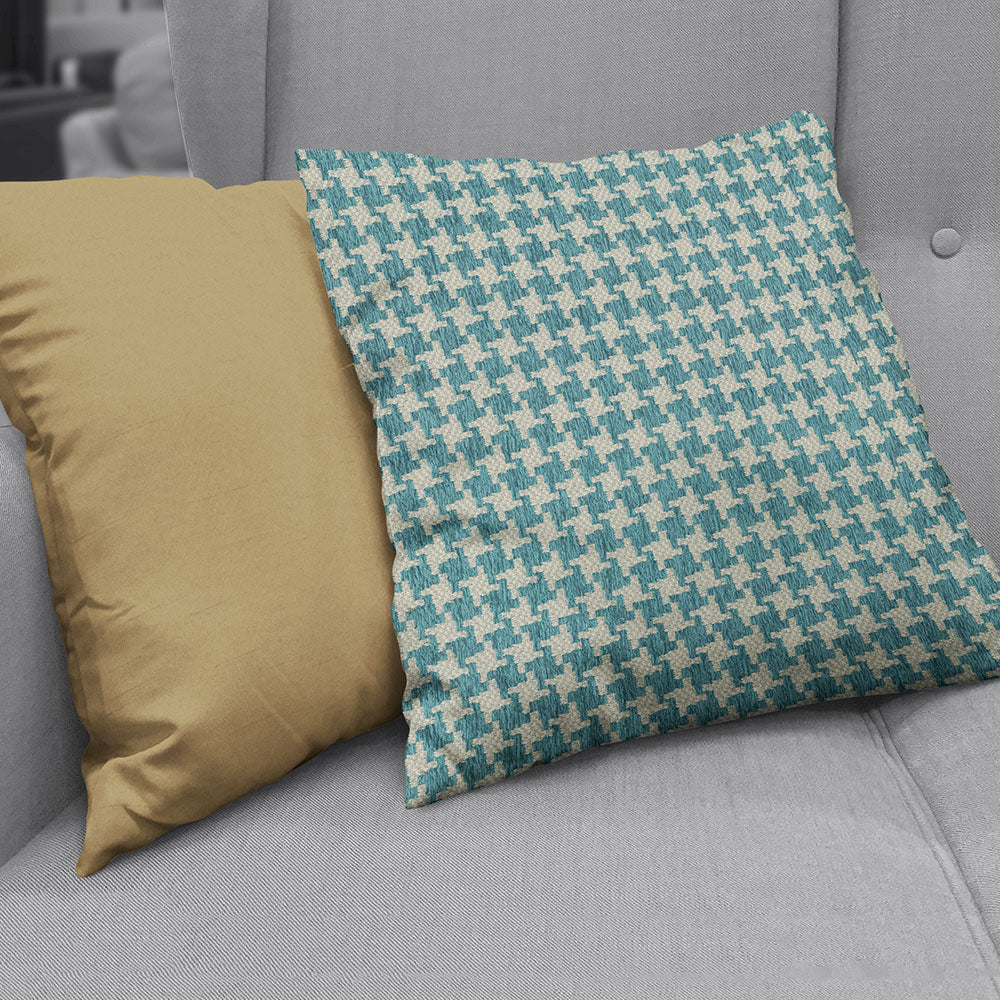 Turquoise houndstooth fabric swatch.
