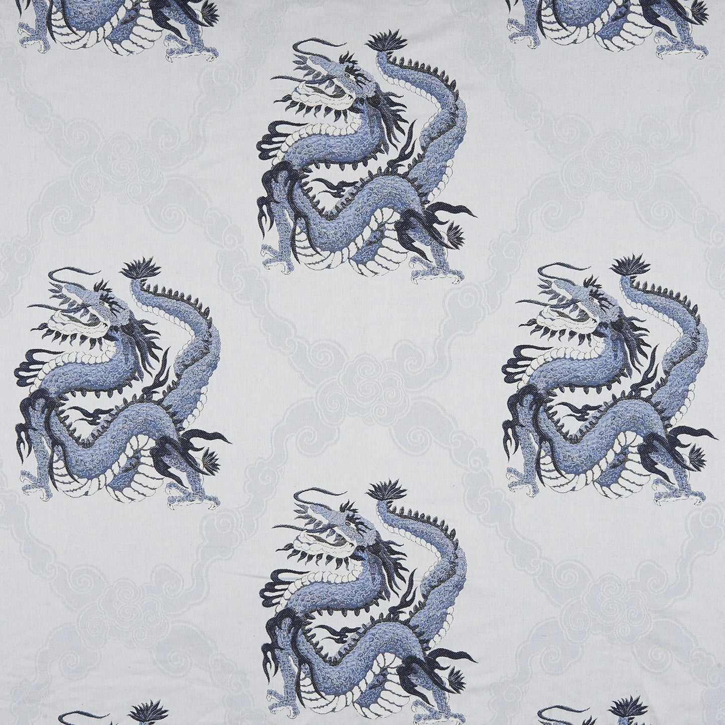Repeating blue dragon motif on a pale gray background with subtle cloud scrolls; Jacquard fabric design.