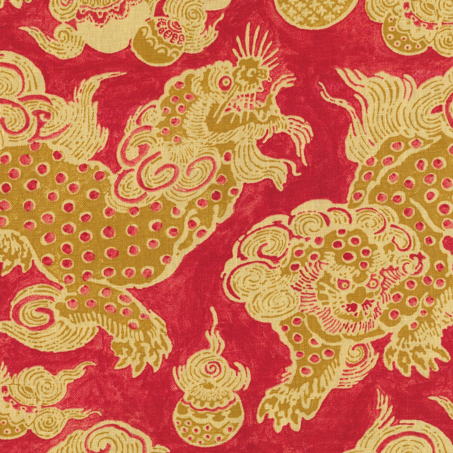 Gold dragon pattern on red fabric; ornate Asian textile with swirling motifs and dotted scales.