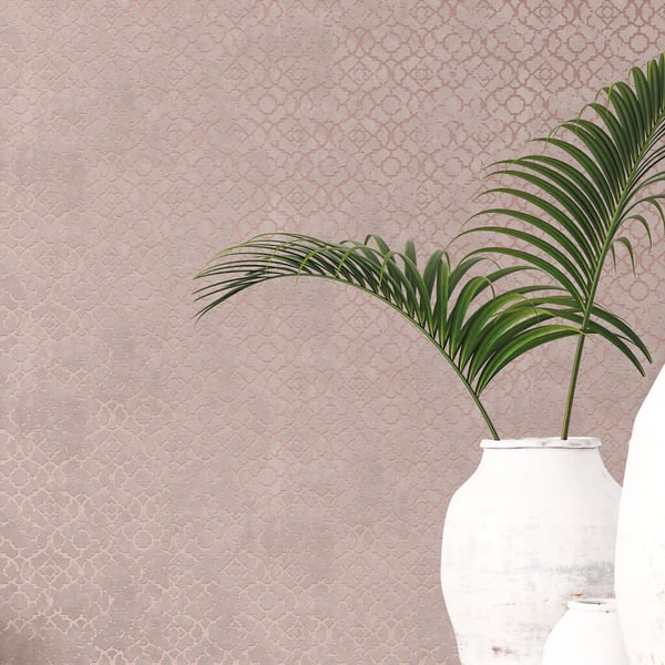 Two white ceramic vases with green palm fronds against a pink textured wall; tropical minimalist home decor.