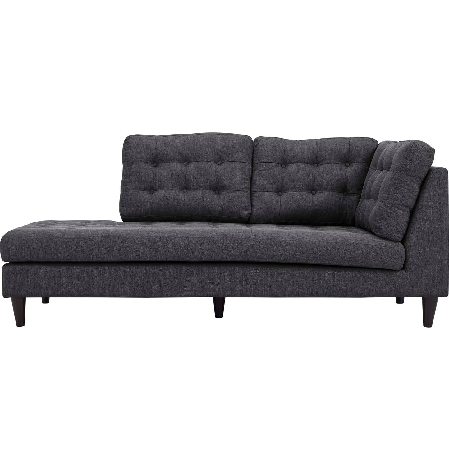 Dark gray tufted fabric sectional sofa with low wooden legs and a left-side chaise.