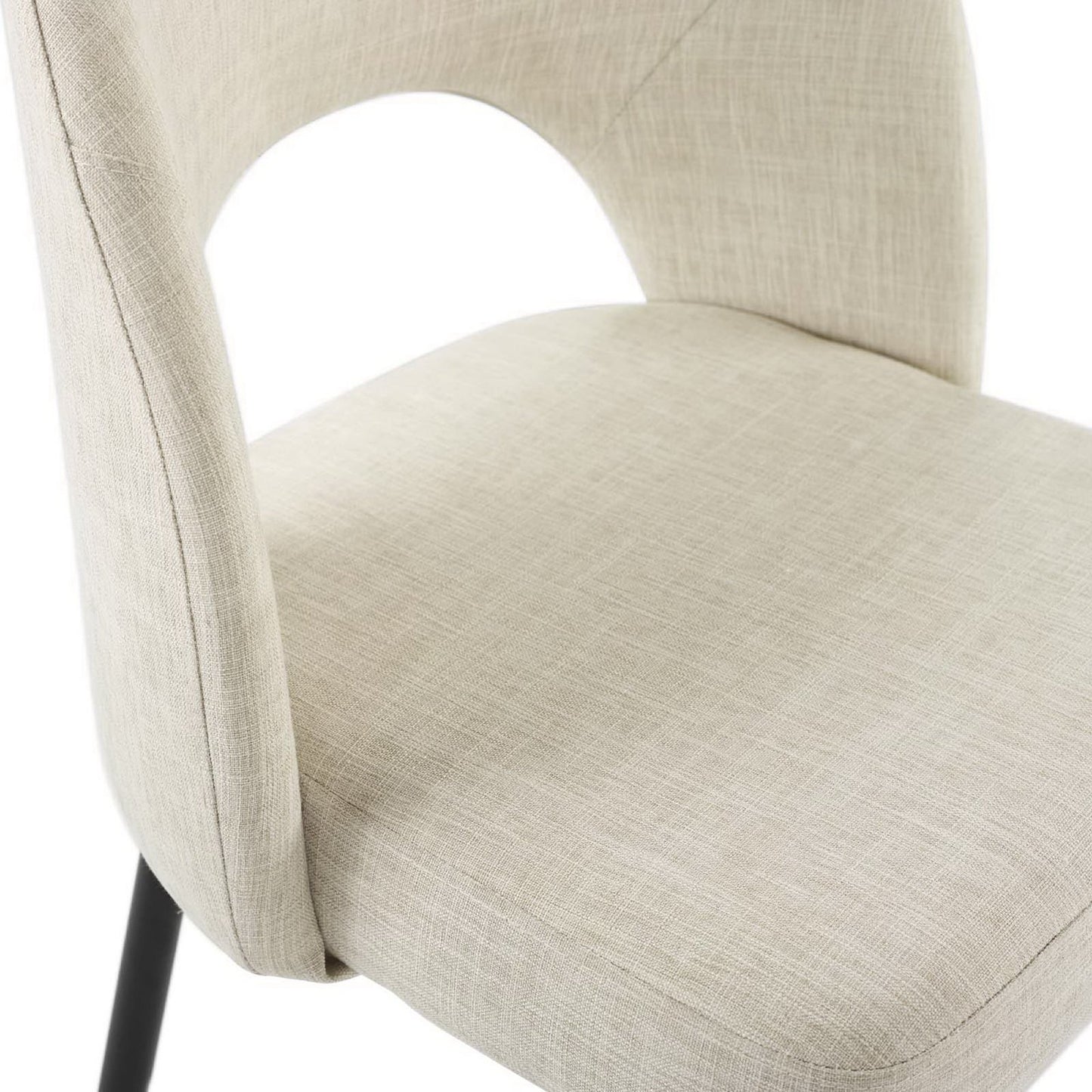 Beige linen dining chair with curved back featuring a circular cutout, black metal legs.