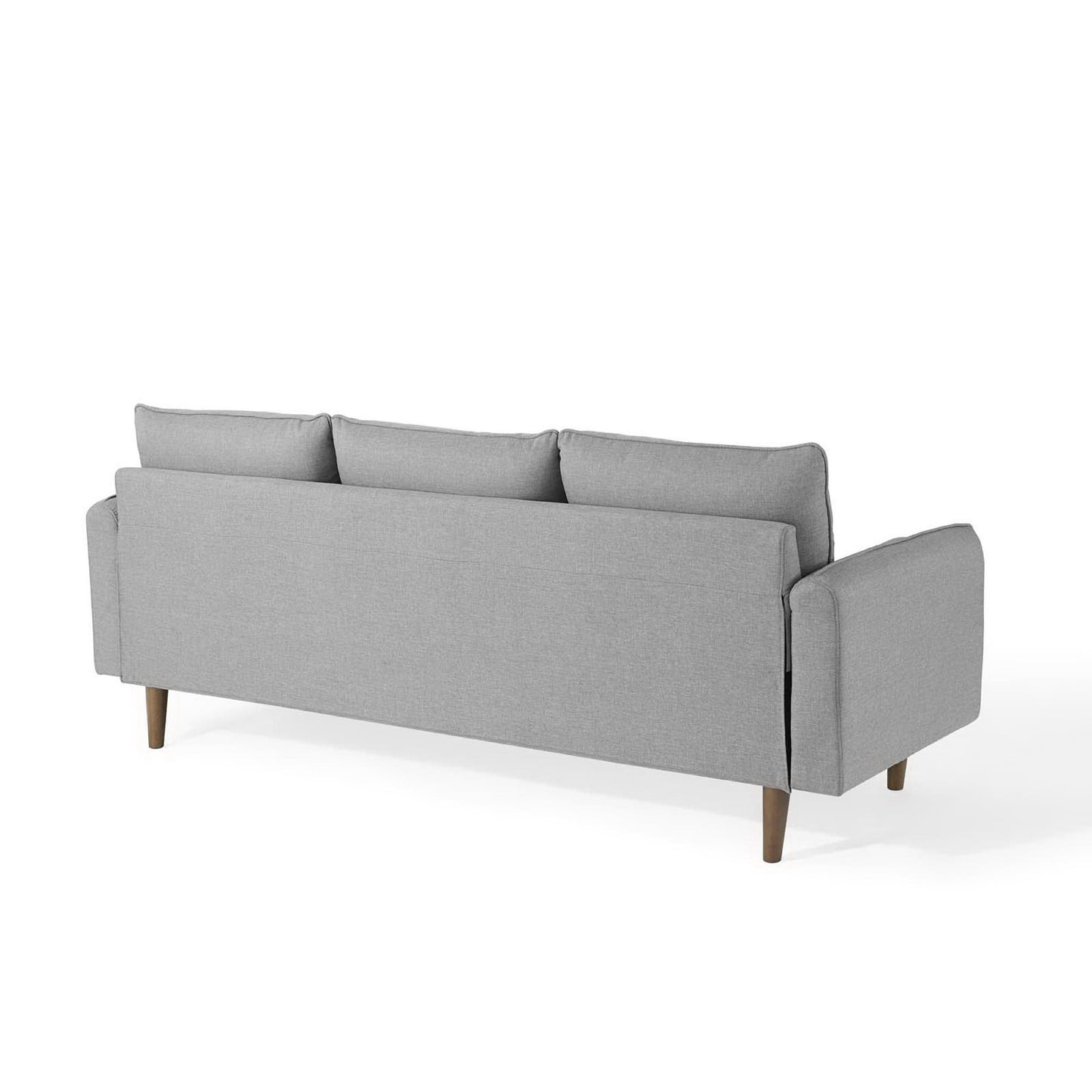 Light gray fabric sectional sofa with wooden tapered legs, three back cushions, square arms, mid-century modern style.
