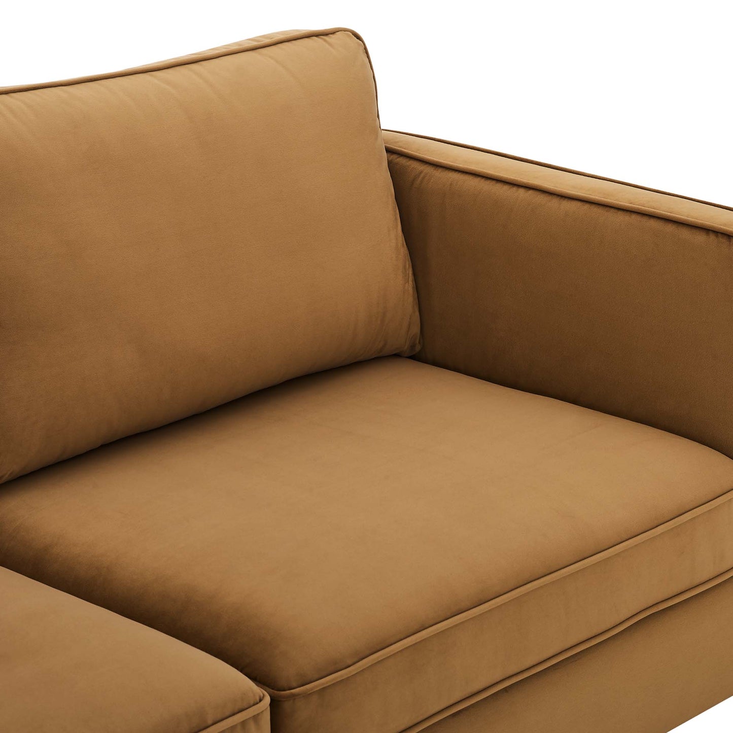 Caramel-tan upholstered sofa with plush seat cushion and matching back and side cushions.
