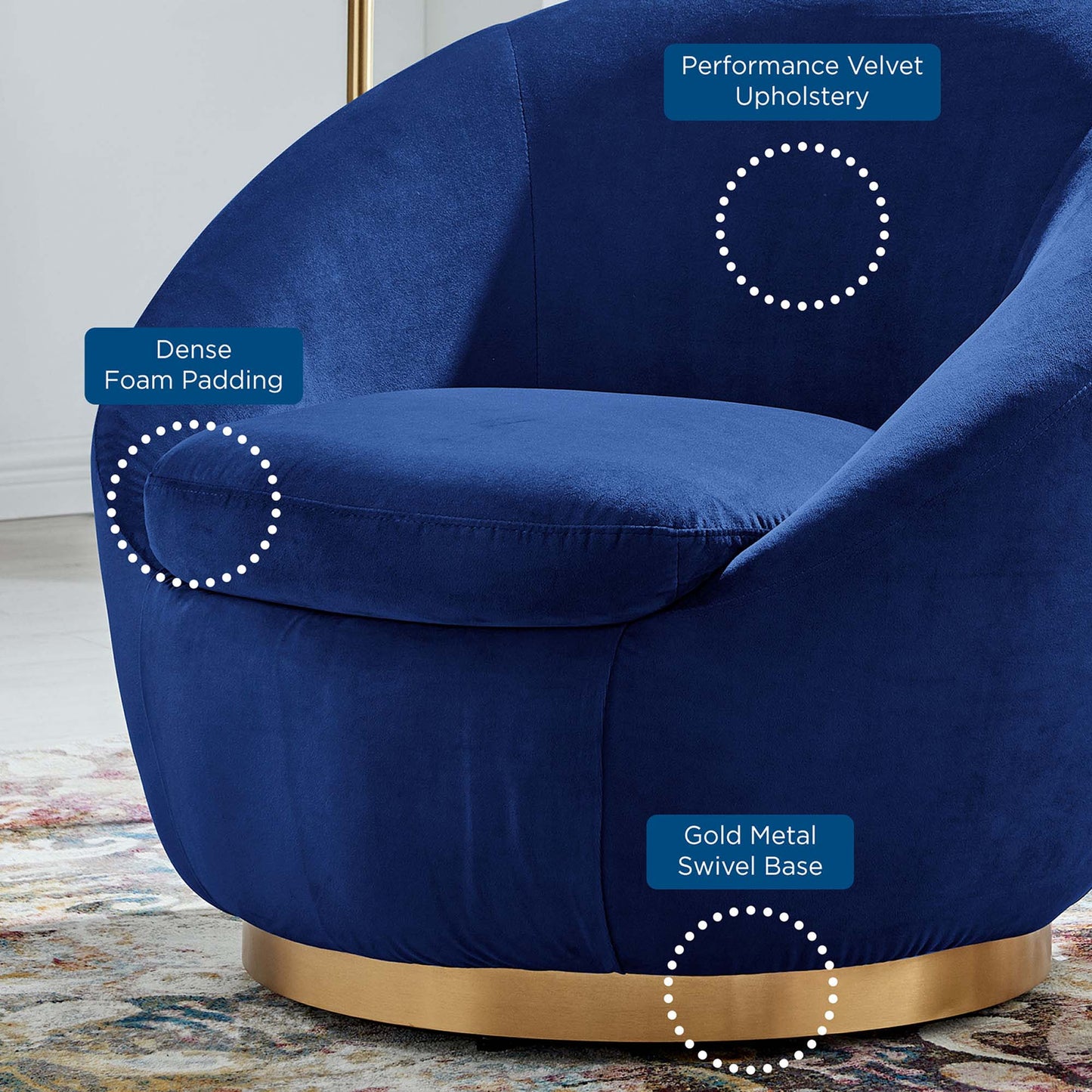 Navy blue velvet swivel chair with dense foam padding, curved silhouette, and a gold metal base.