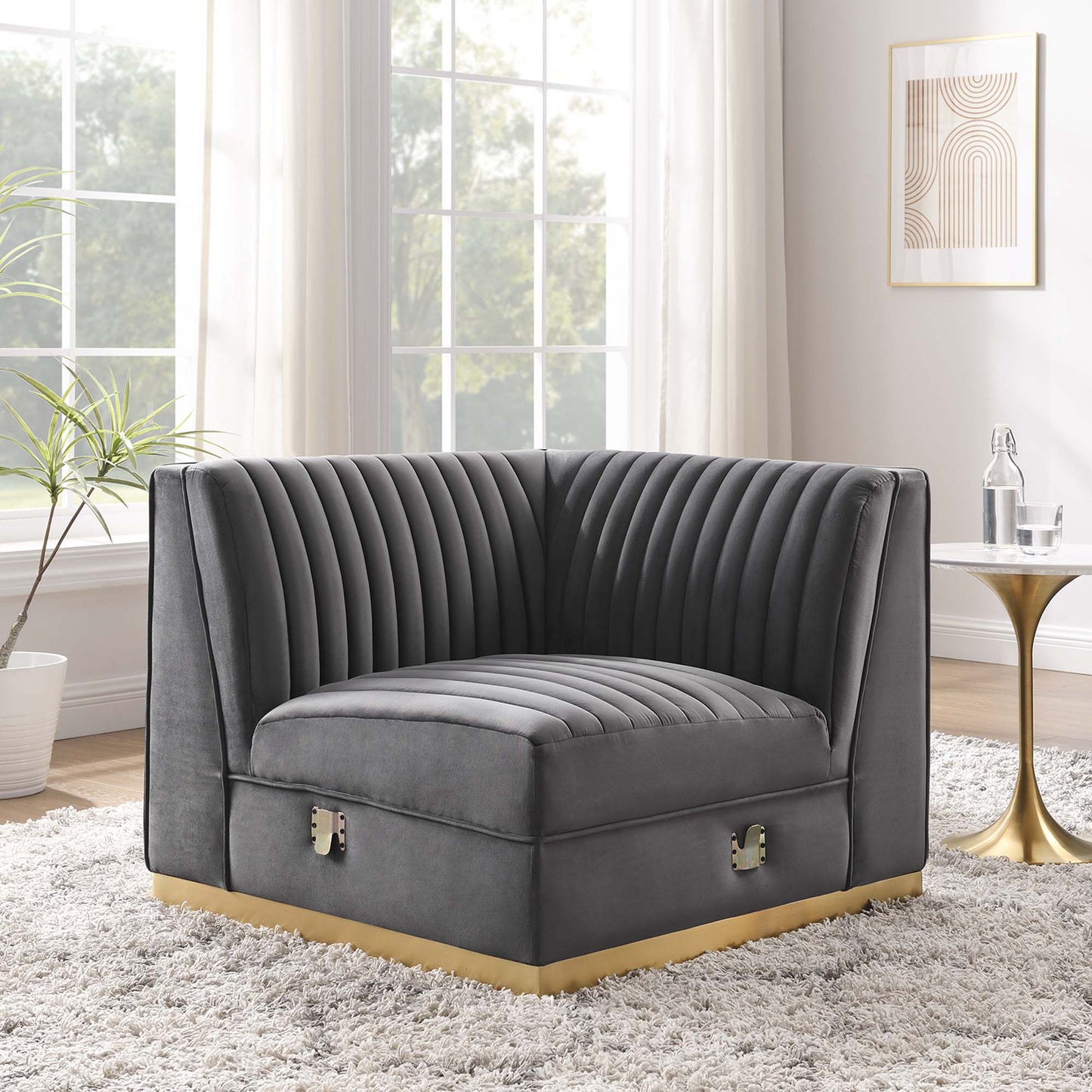 Gray velvet channel-tufted modular sectional right-corner chair with curved back and arms.