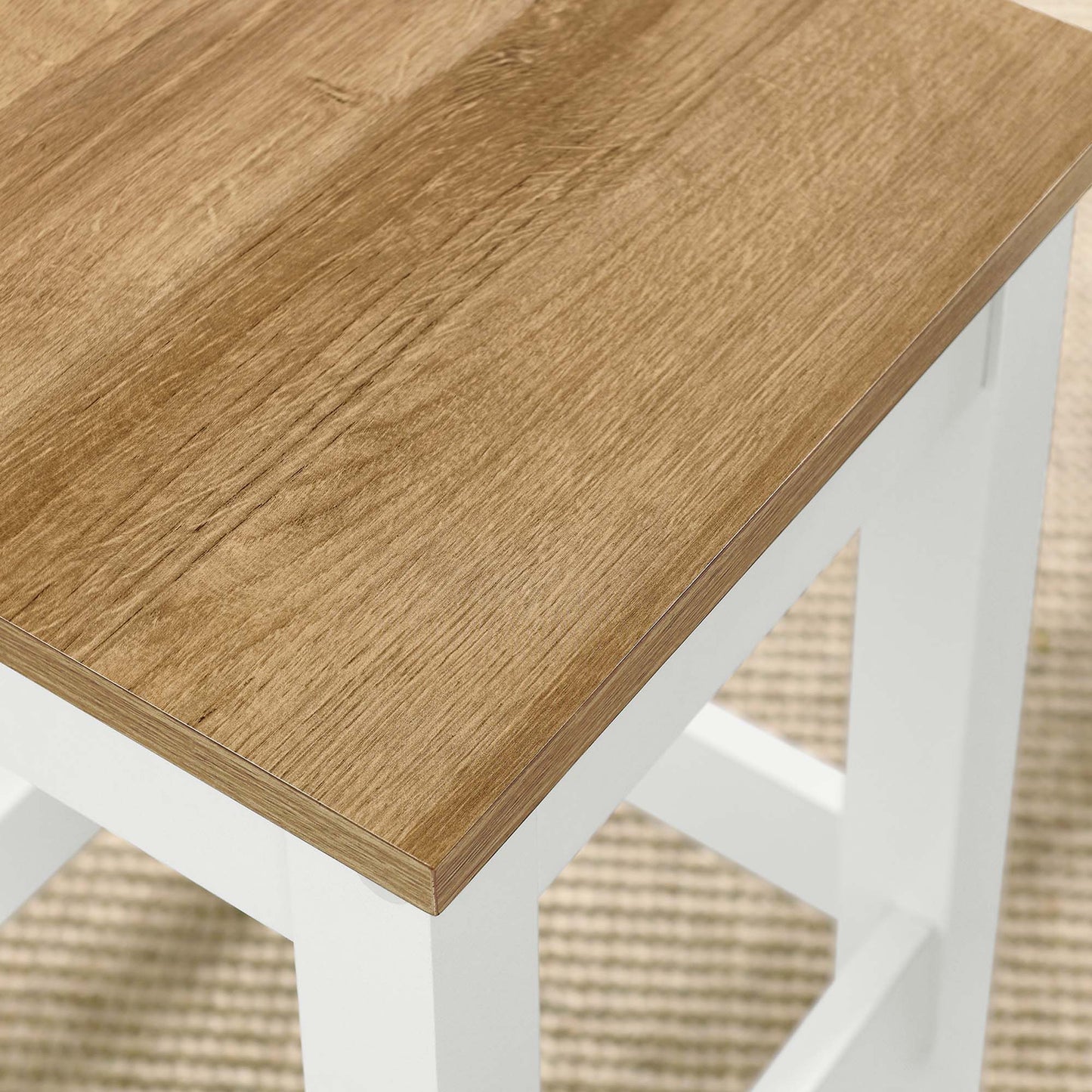 White bar stool with an oak-veneer seat and cross-brace supports.