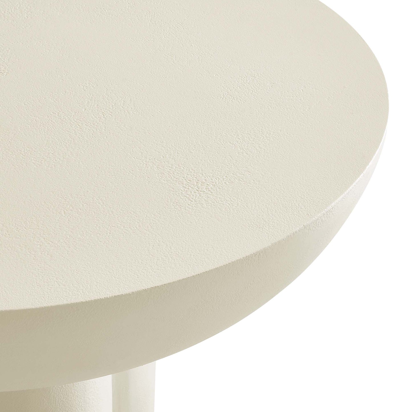 Round cream-white round table top with a subtly textured matte finish on a slim pedestal base.