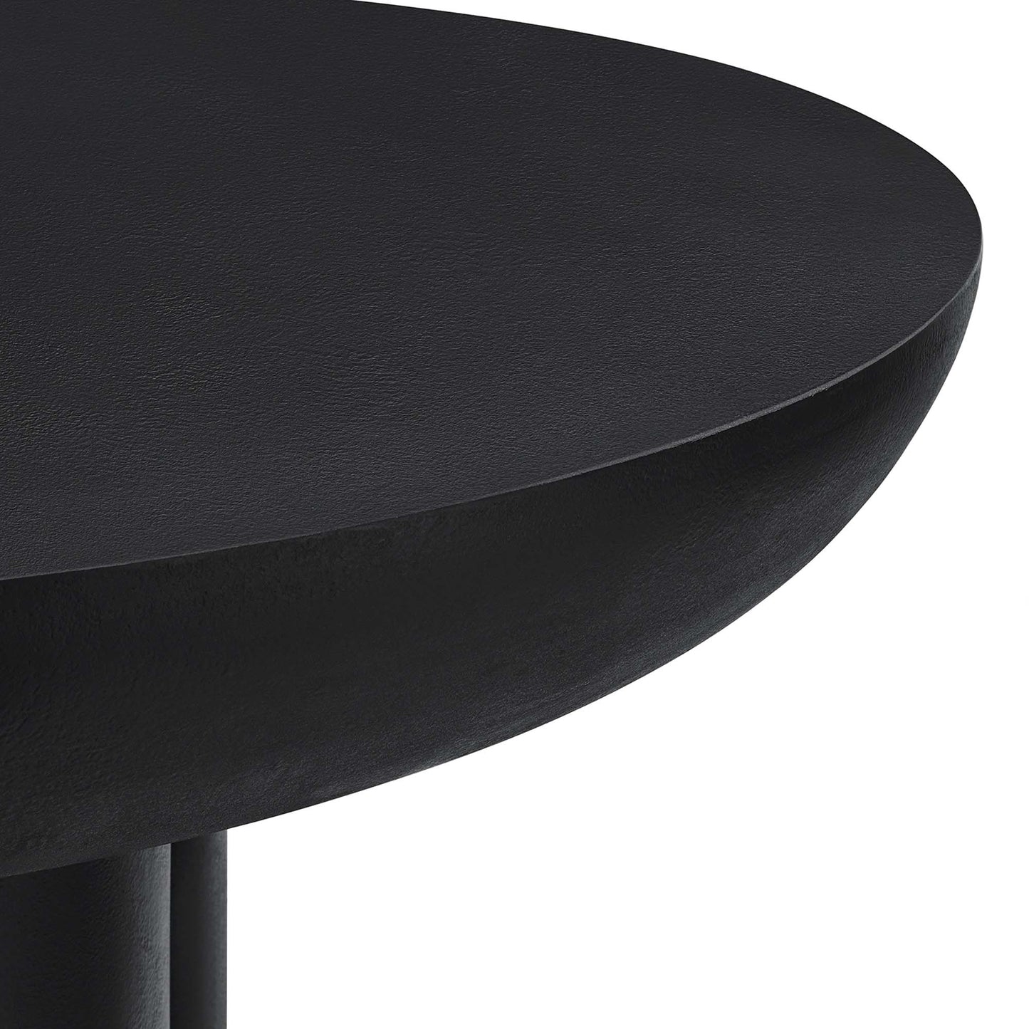 Black round table top with matte finish and curved edge, supported by a pedestal leg.