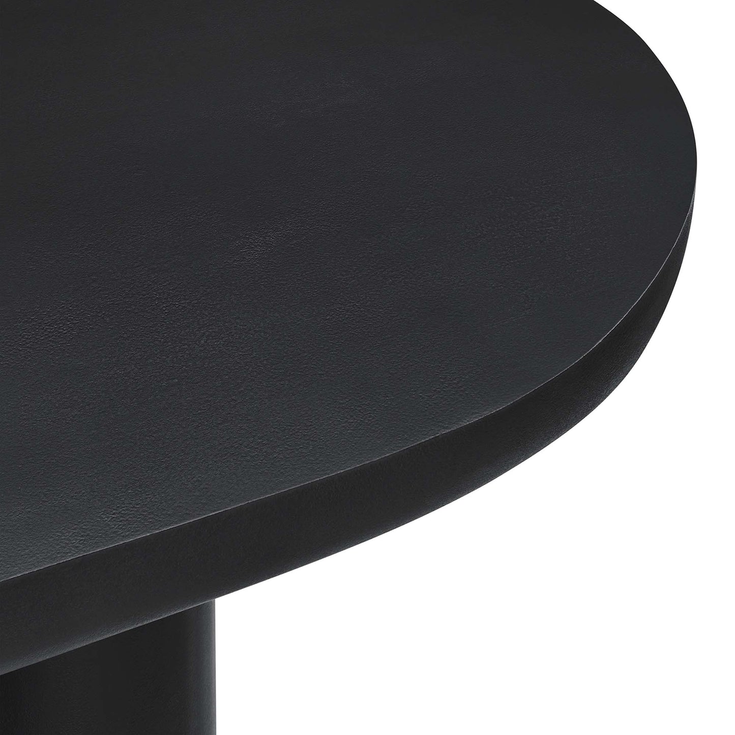 Black 72" oval concrete dining table with a pedestal base; smooth rounded edges visible.