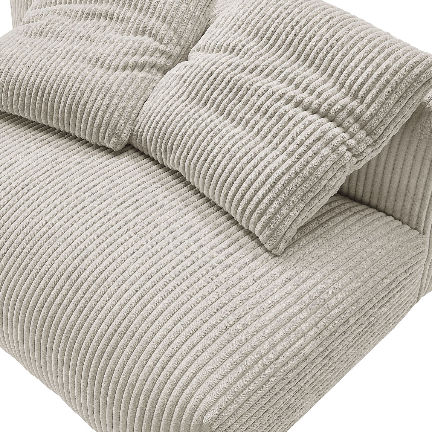 Two brown corduroy throw pillows with vertical ribbed texture on a plush loveseat.