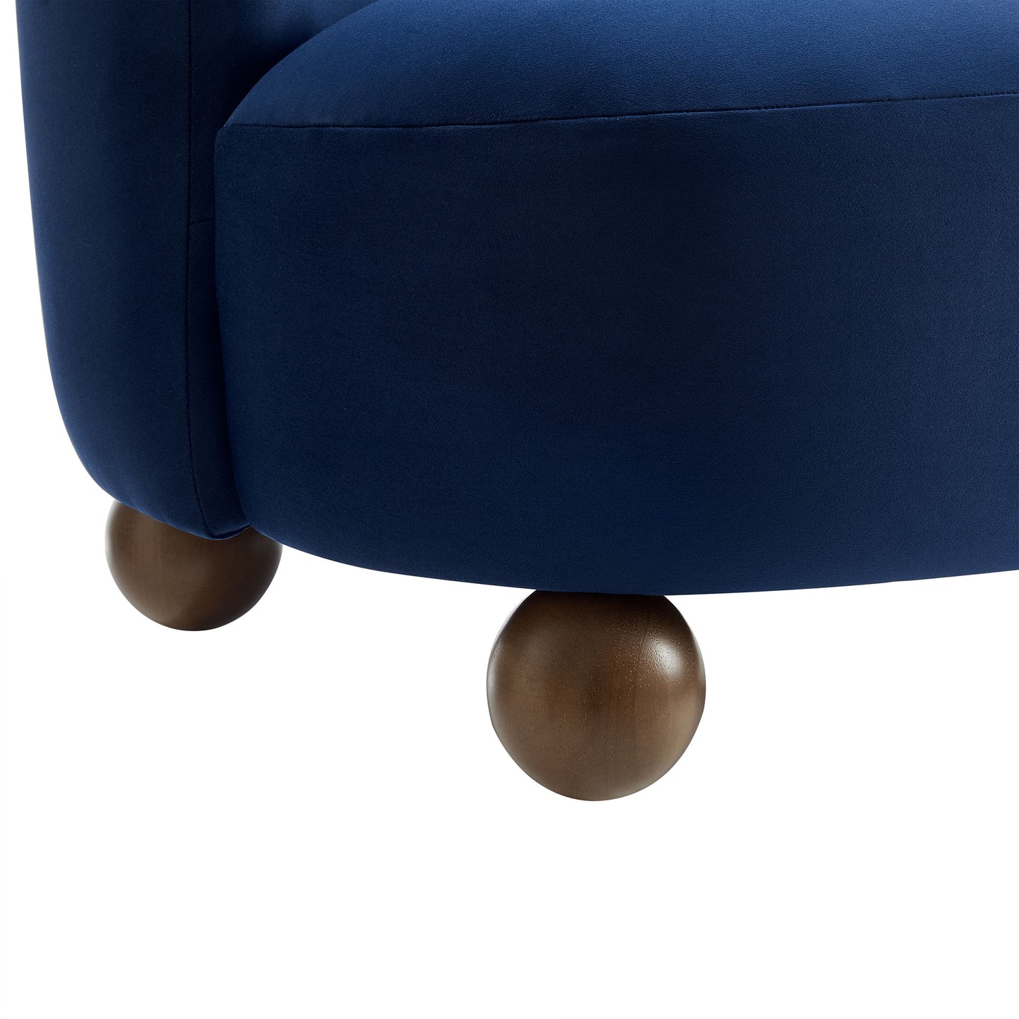 Brown velvet accent chair with rounded wooden ball feet.
