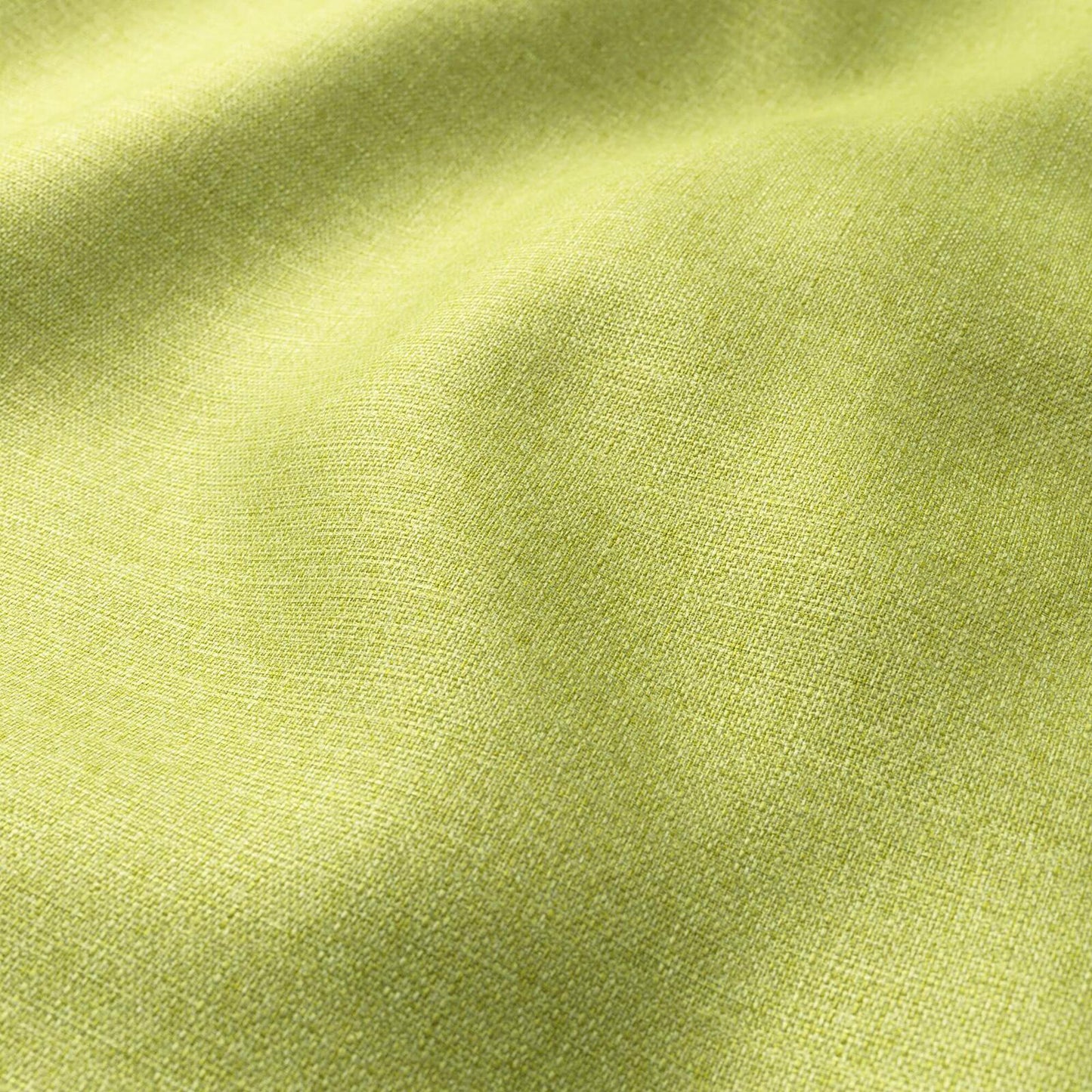 Lime green woven fabric close-up with soft folds and a textured surface