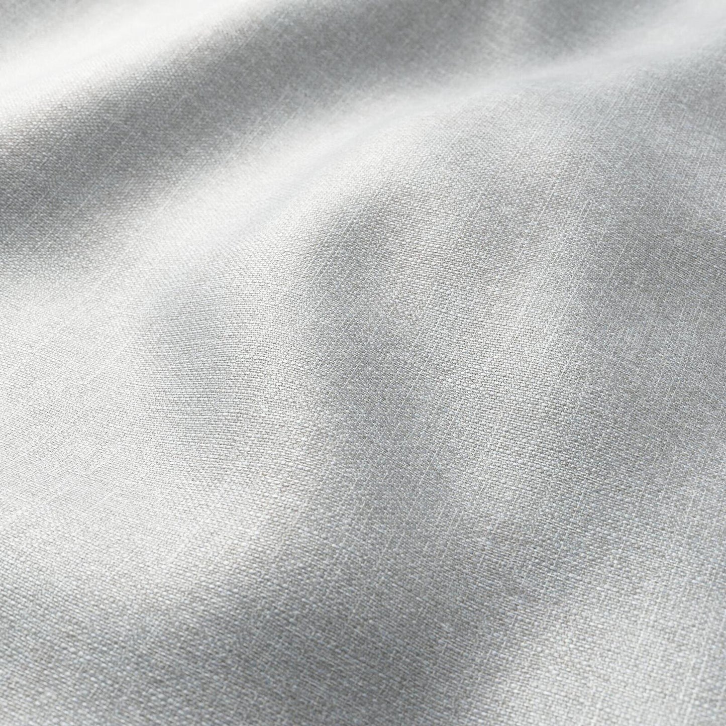 Light gray linen-like fabric close-up with subtle weave texture and soft folds.