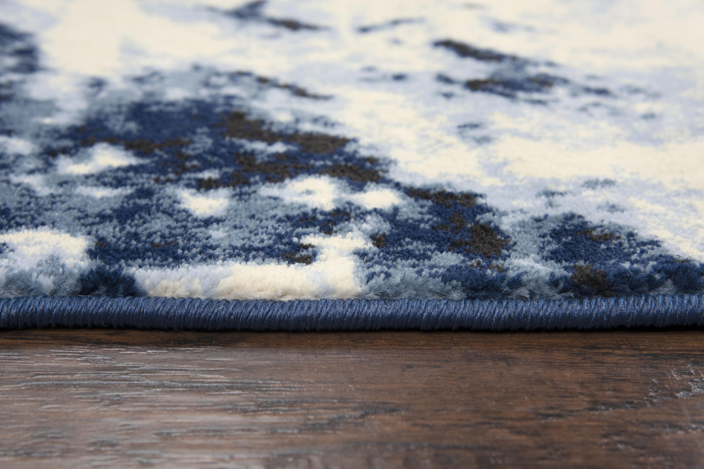5x8 blue abstract area rug with mid century modern design, soft heat set polypropylene rug, power loomed durable synthetic rug for living room or bedroom, modern blue rug with artistic pattern, easy care high-traffic area rug, contemporary home decor carpet