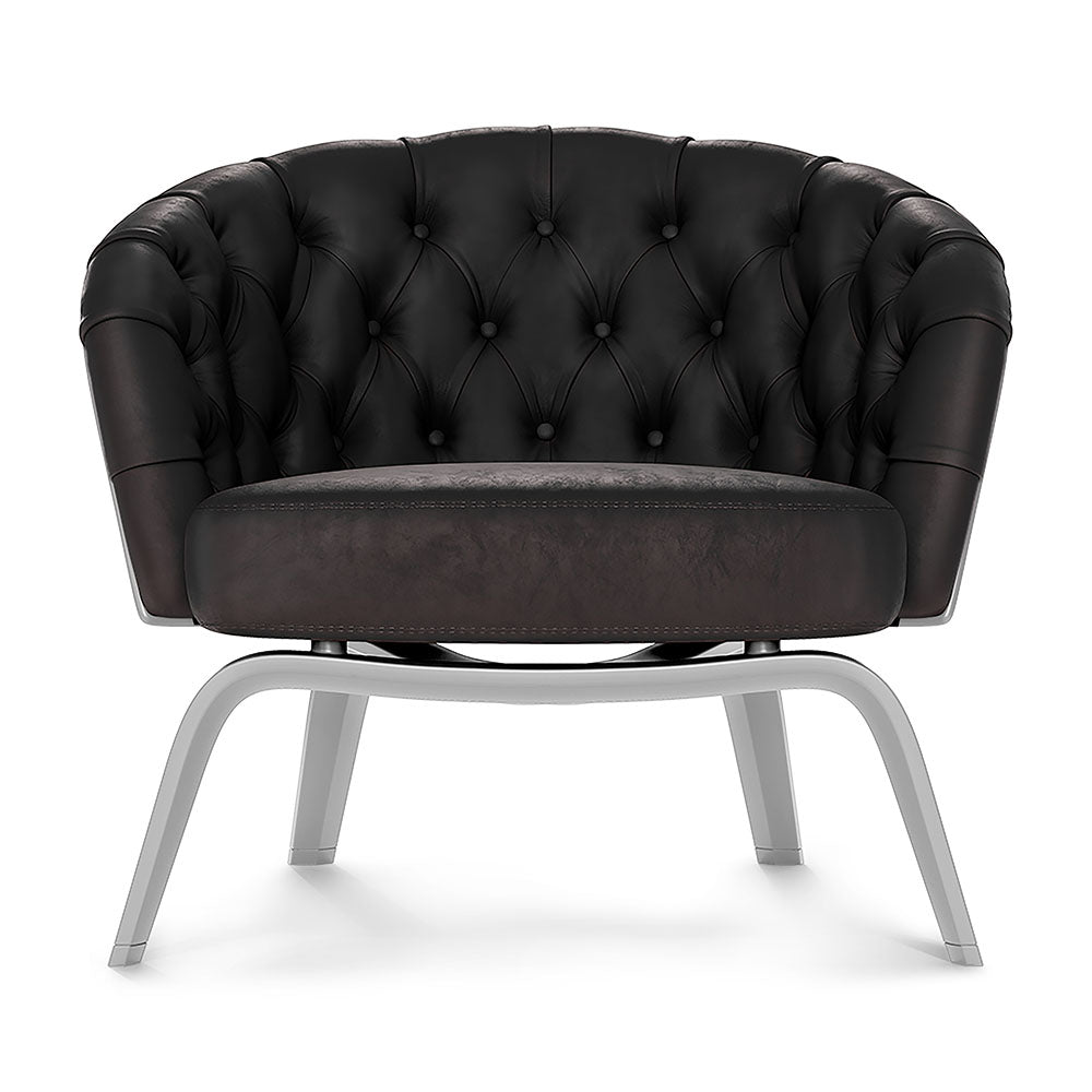 Red solid patent fabric lounge chair with curved back, round cushion seat, and metal sled legs.