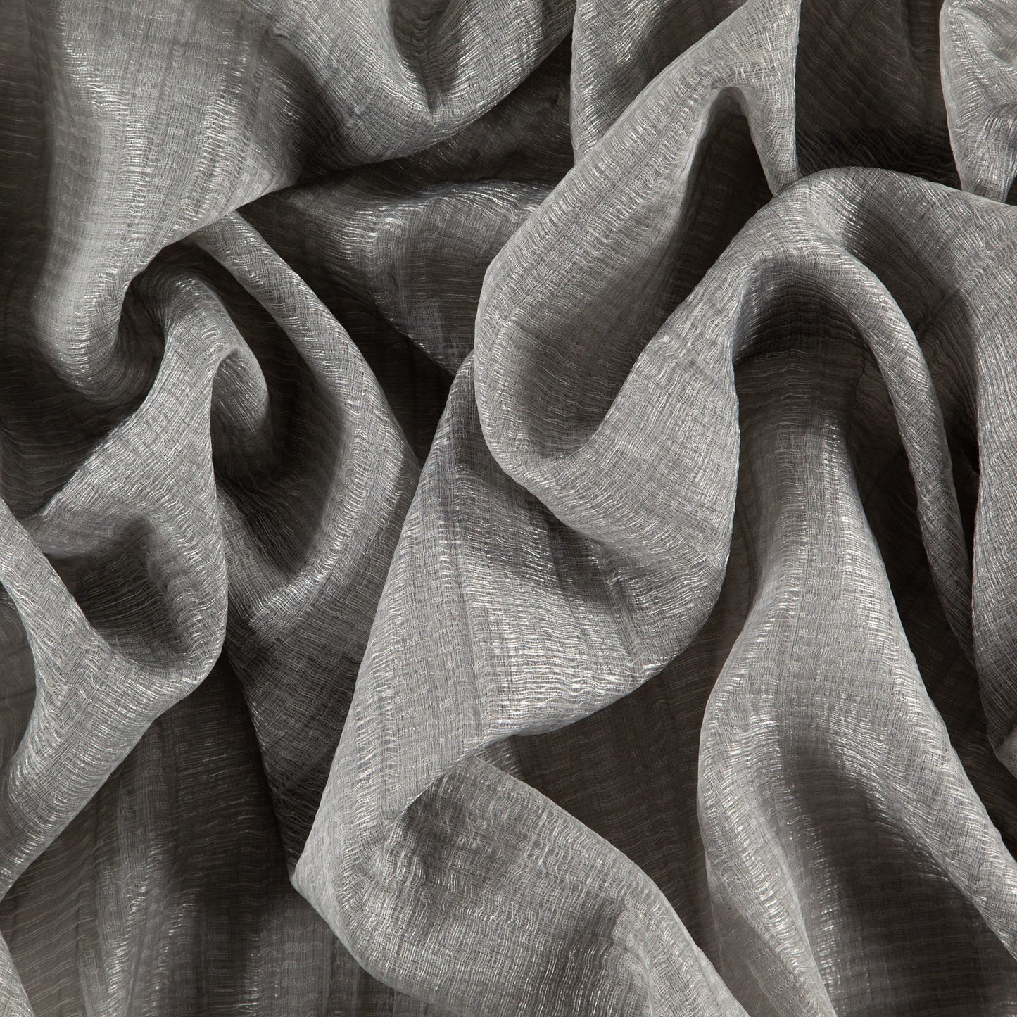 Gray sheer woven fabric with rippled texture and flowing drape.