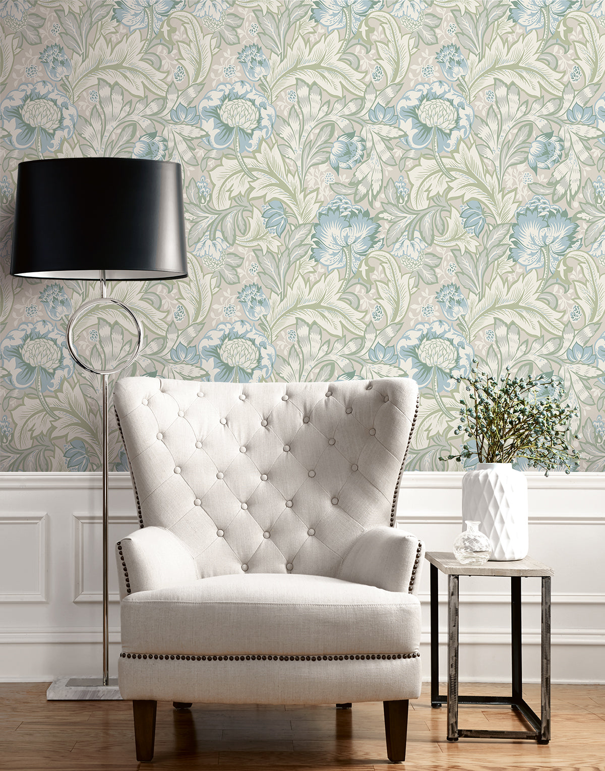 Close‑up of Acanthus Garden wallpaper in Powder Blue & Green Mist: large stylised acanthus leaves, florals and berries in soft blue and green tones on a matte non‑woven background, roll approx 20.9″ wide with 25.2″ pattern repeat.