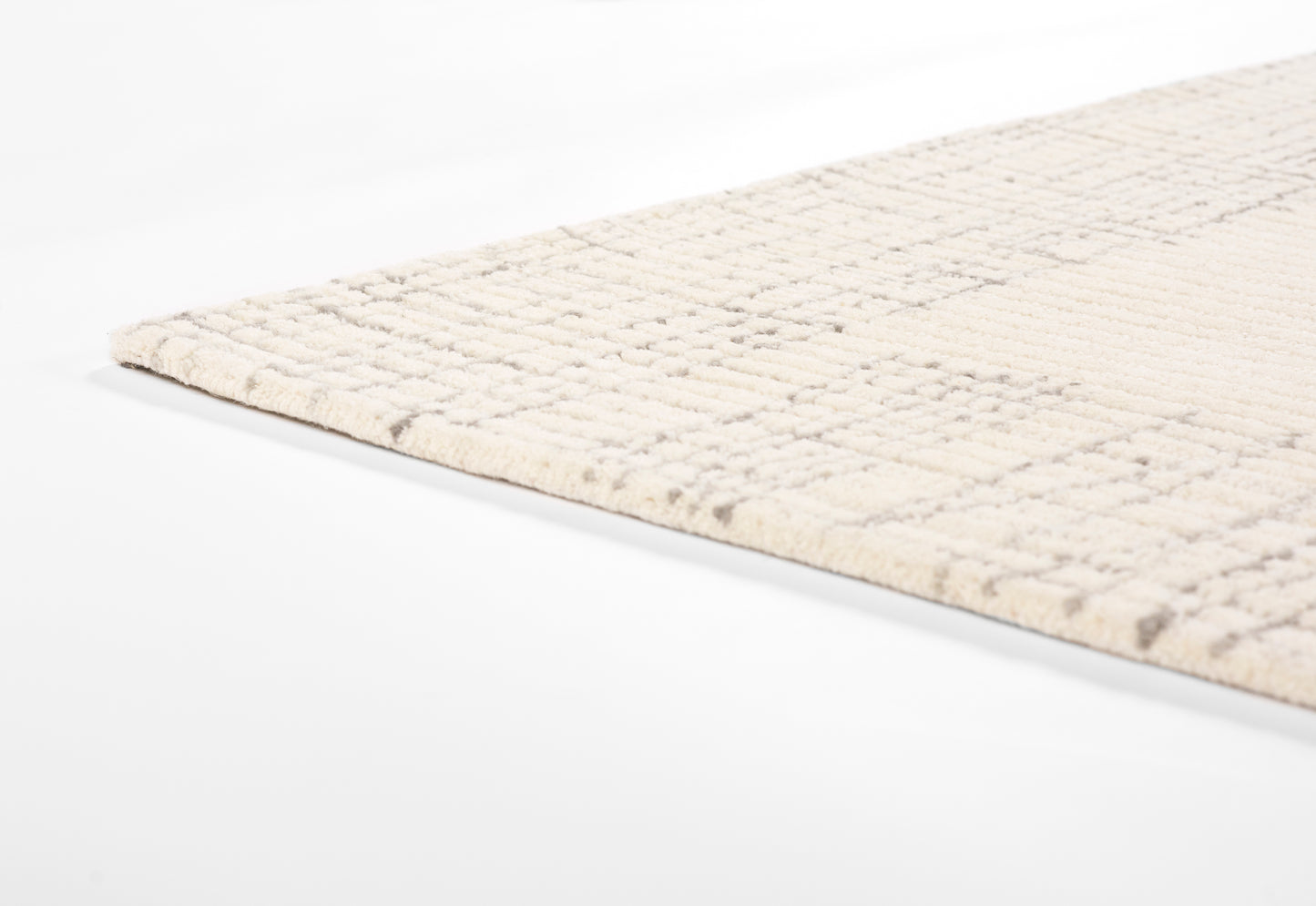 Beige woven area rug with subtle square grid pattern and cropped edge, modern rectangular decor.