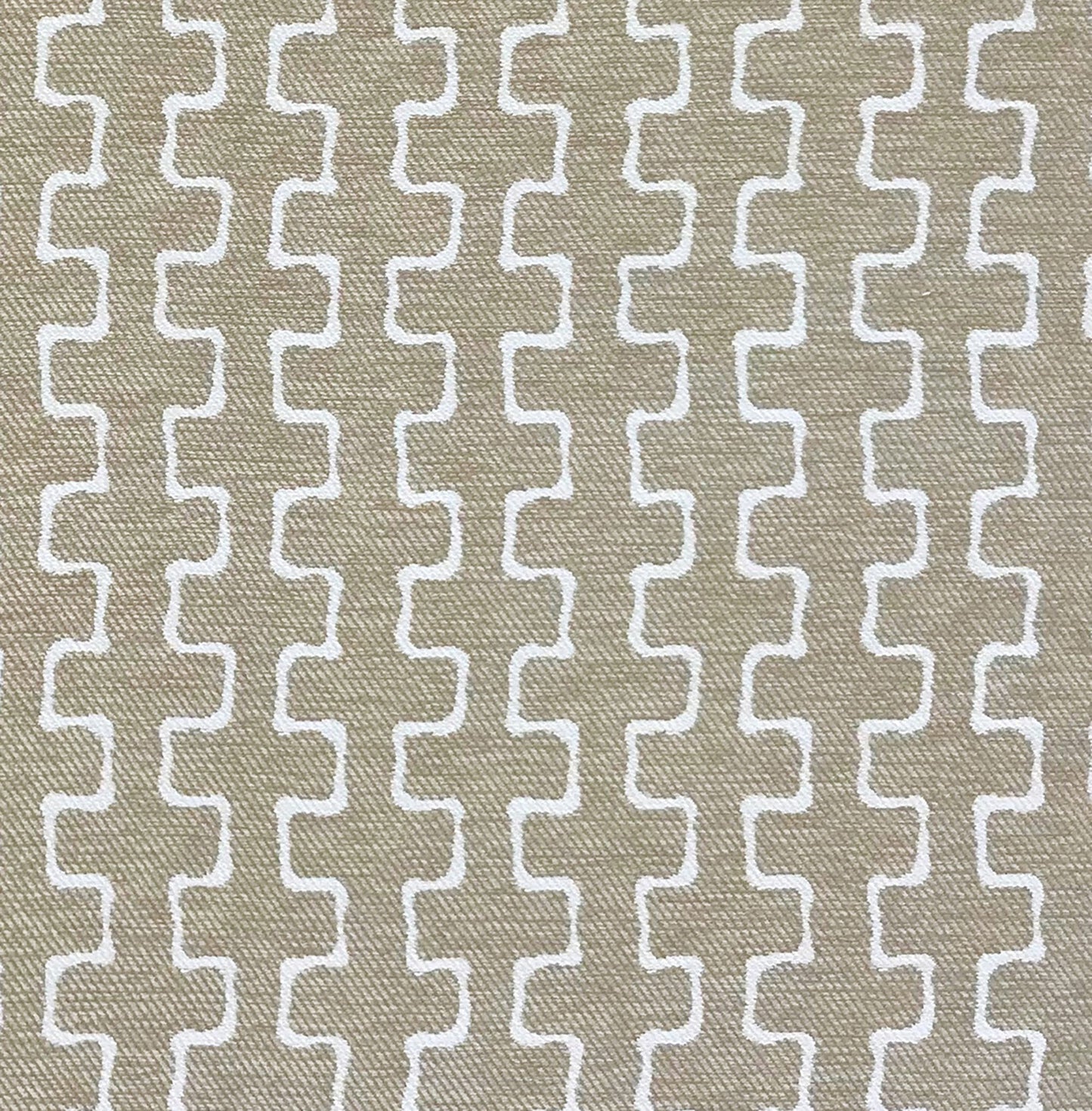 Beige woven outdoor fabric with a white interlocking curved-line geometric pattern; textured, modern jacquard twill.